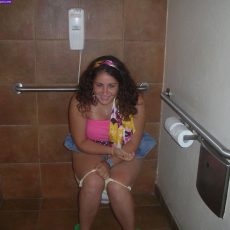 Amateurs sitting on the toilet with lowered panties  